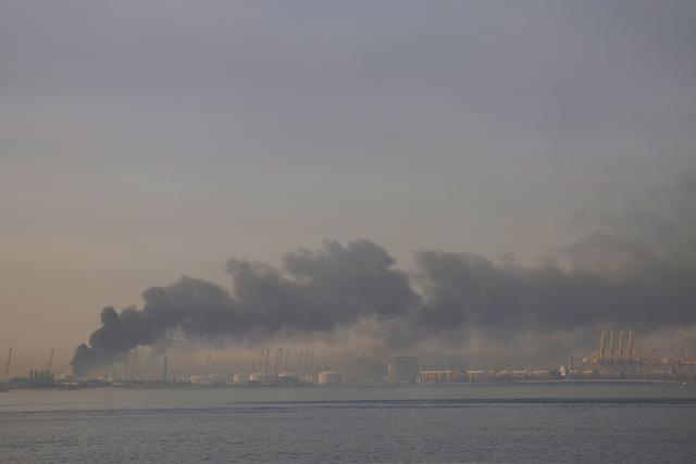 TOPSHOT - A plume of smoke rises from the port of Jebel Ali following a reported Iranian strike in Dubai on March 1, 2026. Fresh blasts were heard across the Gulf cities of Dubai, Doha and Manama on Sunday morning after a day of Iran strikes in the region in retaliation for US and Israeli attacks. (Photo by Fadel SENNA / AFP)