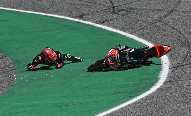 MT Helmets-MSi's Japanese rider Ryusei Yamanaka crashes during the Moto3 race at the MotoGP Thailand Grand Prix at the Buriram International Circuit in Buriram on March 1, 2026. (Photo by Lillian SUWANRUMPHA / AFP)