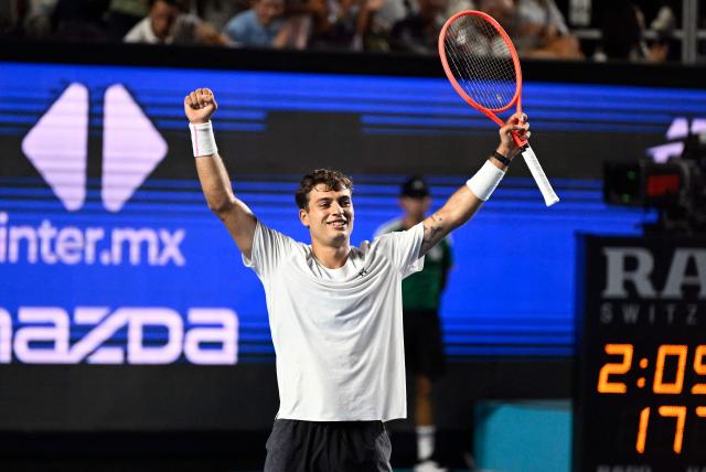 Italy's Flavio Cobolli celebrates his victory against US' Frances Tiafoe during the 2026 Mexico ATP 500 Tennis Open men's singles tennis final match at the Arena GNP Seguros in Acapulco, Guerrero State, Mexico on February 28, 2026. (Photo by Alfredo ESTRELLA / AFP)
