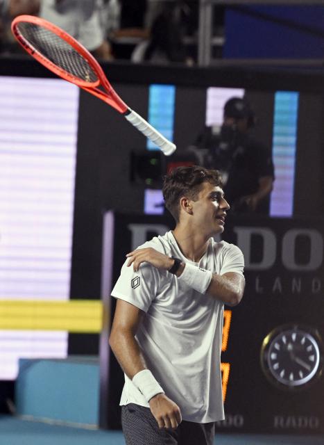 Italy's Flavio Cobolli celebrates his victory against US' Frances Tiafoe during the 2026 Mexico ATP 500 Tennis Open men's singles tennis final match at the Arena GNP Seguros in Acapulco, Guerrero State, Mexico on February 28, 2026. (Photo by Alfredo ESTRELLA / AFP)