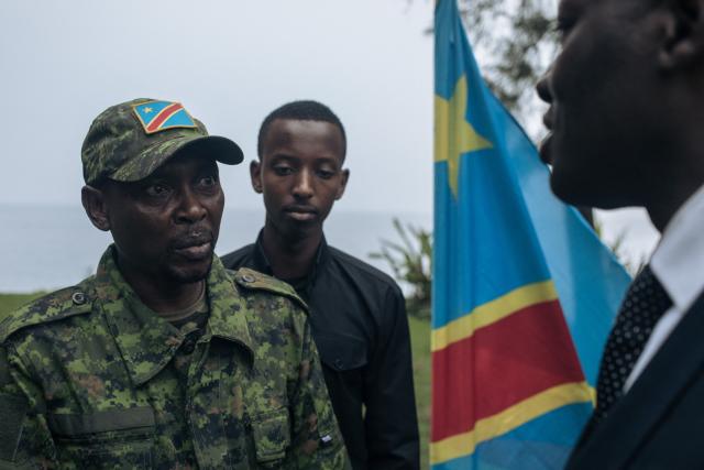 (FILES) Willy Ngoma, the M23 military spokeperson talks with another M23 leader at the end of a press conference at the North-Kivu Governorate in Goma on February 6, 2025 following a public gathering called by the armed group. The Rwanda-backed M23 force fighting in eastern DR Congo said February 28, 2026 that its military spokesman had been killed in a Congolese army drone strike.
The announcement came days after government forces in the Democratic Republic of Congo (DRC) targeted the armed group with a drone strike near Rubaya, a strategic mining town in Masisi territory in North Kivu province. (Photo by ALEXIS HUGUET / AFP)
