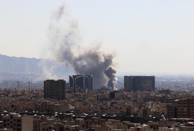 Plumes of smoke rise following reported explosions in Tehran on March 1, 2026. Ayatollah Ali Khamenei, Iran's supreme leader since 1989 and sworn enemy of the West, was killed in the opening salvo of a massive US and Israeli attack, sparking a new wave of retaliatory missile strikes from Tehran on March 1. (Photo by ATTA KENARE / AFP)