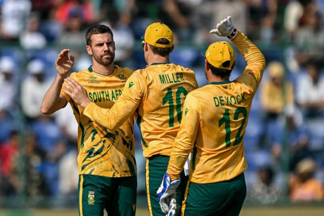 South Africa's Anrich Nortje (L) celebrates with teammates after taking the wicket of Zimbabwe's Brian Bennett during the 2026 ICC Men's T20 Cricket World Cup Super Eights match between Zimbabwe and South Africa at the Arun Jaitley Stadium in New Delhi on March 1, 2026. (Photo by Sajjad HUSSAIN / AFP)
