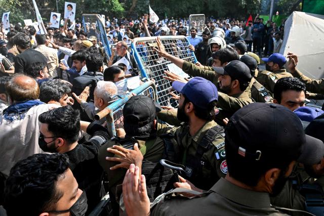 Pakistani Shiite Muslims in solidarity with Iran clash with police during an anti-US-Israel protest in Lahore on March 1, 2026. Iranian state television confirmed the death of its supreme leader Ayatollah Ali Khamenei and launched a fresh wave of attacks on March 1, as Israel hit back at the capital Tehran. In Pakistan, eight people were killed as hundreds of protesters tried to storm the US consulate in the megacity of Karachi, the local rescue service said. (Photo by Arif ALI / AFP)