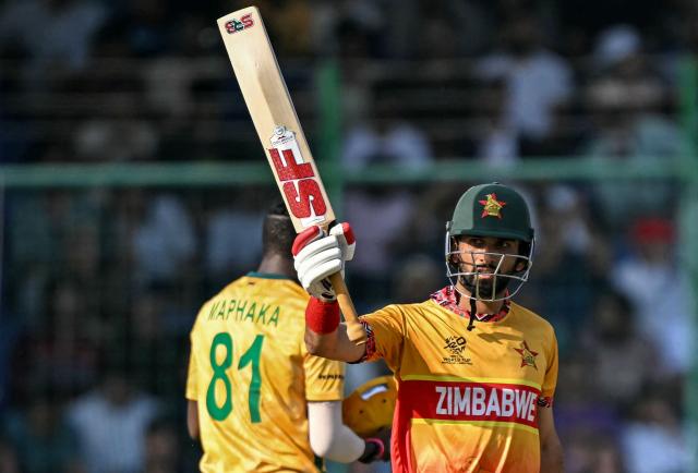 Zimbabwe's captain Sikandar Raza celebrates after scoring a half-century (50 runs) during the 2026 ICC Men's T20 Cricket World Cup Super Eights match between Zimbabwe and South Africa at the Arun Jaitley Stadium in New Delhi on March 1, 2026. (Photo by Sajjad HUSSAIN / AFP)