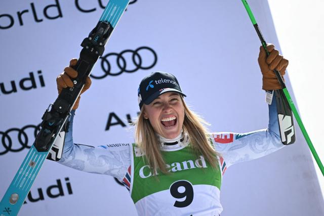 Third-placed Norway's Kajsa Vickhoff Lie celebrates on the podium after competing in the women's super G race, part of the FIS Alpine Ski World Cup 2025-2026 in Soldeu, Andorra on March 1, 2026. (Photo by Lionel BONAVENTURE / AFP)