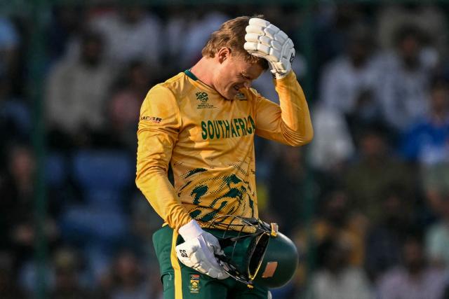 South Africa's Ryan Rickelton reacts after being hit by the ball during the 2026 ICC Men's T20 Cricket World Cup Super Eights match between Zimbabwe and South Africa at the Arun Jaitley Stadium in New Delhi on March 1, 2026. (Photo by Sajjad HUSSAIN / AFP)