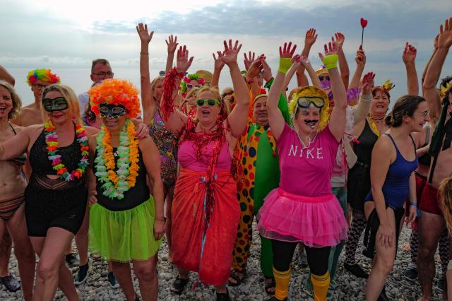 Revellers attend the traditional carnival bath during the 141th edition of the Nice Carnival on the French riviera city of Nice on March 1, 2026. (Photo by Valery HACHE / AFP)