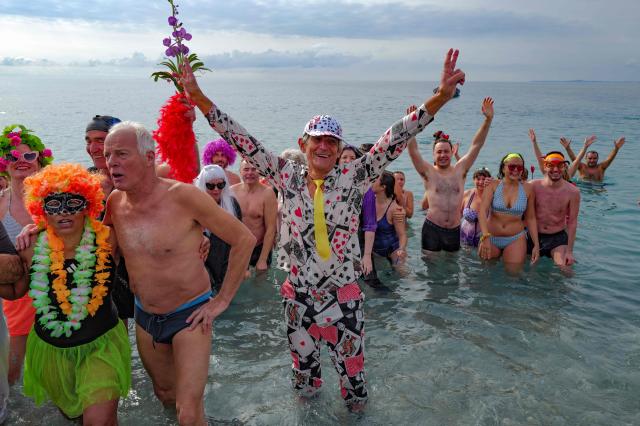 Revellers attend the traditional carnival bath during the 141th edition of the Nice Carnival on the French riviera city of Nice on March 1, 2026. (Photo by Valery HACHE / AFP)