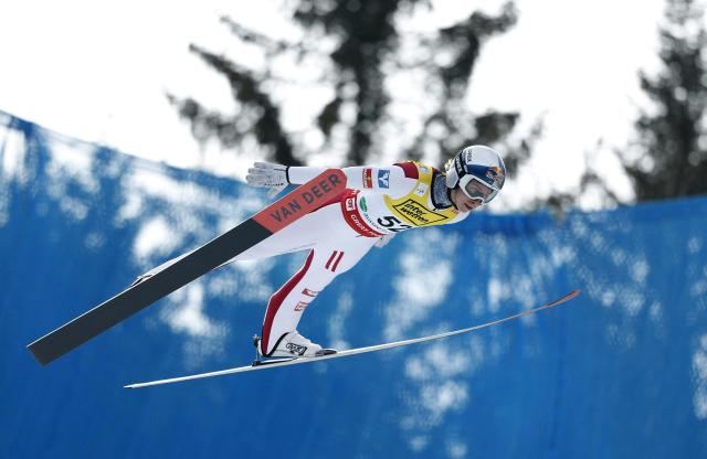 Austria's Daniel Tschofenig soars through the air during the qualification round of the Men Flying Hill Individual HS235 competition of the FIS Ski Jumping World Cup in Kulm Bad Mitterndorf, Austria, on March 1, 2026. (Photo by ERWIN SCHERIAU / APA / AFP) / Austria OUT