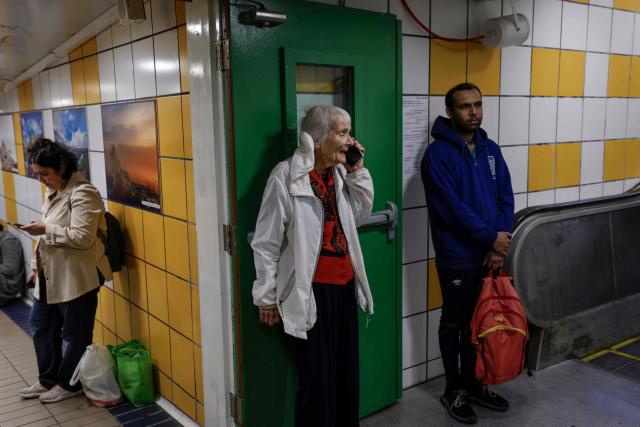 People take shelter in an underground station in Haifa on March 1, 2026, amid Iranian attack fears. Iran launched strikes across the Gulf on March 1 after vowing to avenge slain supreme leader Ayatollah Ali Khamenei, defying a threat from President Donald Trump to strike with unprecedented force. (Photo by Jalaa MAREY / AFP)
