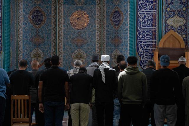Muslim worshippers pray in memory of Iran’s Supreme Leader Ayatollah Ali Khamenei at the Ahlul Bait Mosque Complex in Cape Town on March 1, 2026. Ayatollah Ali Khamenei, Iran's supreme leader since 1989 and sworn enemy of the West, was killed in the opening salvo of a massive US and Israeli attack, sparking a new wave of retaliatory missile strikes from Tehran on March 1, 2026. (Photo by RODGER BOSCH / AFP)