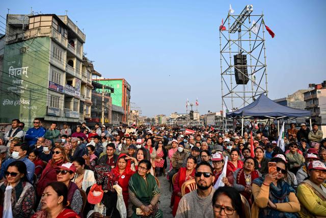 Supporters listen to Nepali Congress party president and election candidate Gagan Thapa during a rally in Kathmandu on March 1, 2026 ahead of parliamentary elections in Nepal. (Photo by TAUSEEF MUSTAFA / AFP)