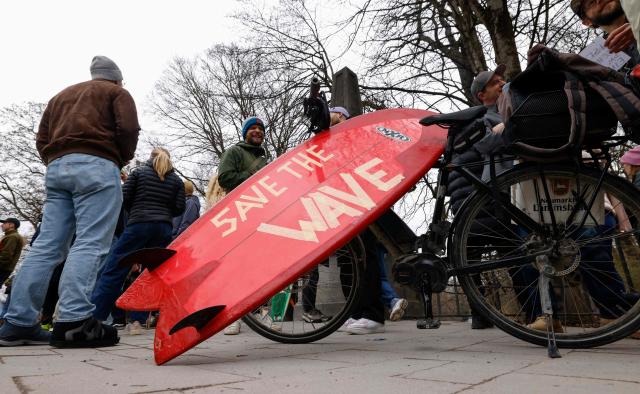 People take part in a demonstration against the closed wave called "Eisbachwelle" in Munich, Bavaria, southern Germany, on March 1, 2026. (Photo by Michaela STACHE / AFP)