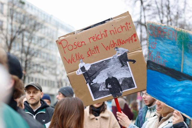 People take part in a demonstration against the closed wave called "Eisbachwelle" in Munich, Bavaria, southern Germany, on March 1, 2026. (Photo by Michaela STACHE / AFP)