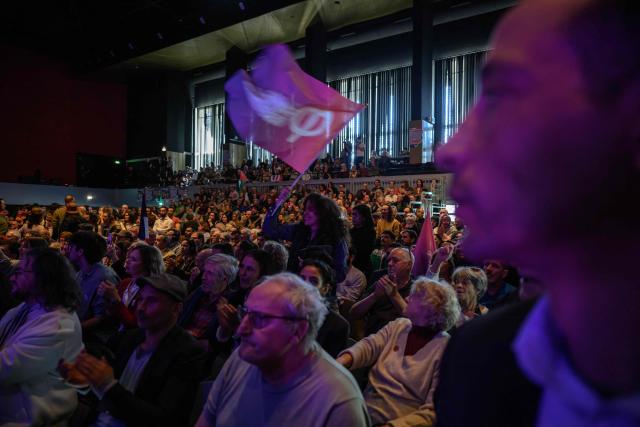 Supporters cheer prior to a speech by French leftist La France Insoumise (LFI) party Perpignan mayoral candidate Mickael Idrac  during a campaign rally ahead of France's municipal elections, in Perpignan, southern France, on March 1, 2026. French voters head to the polls for municipal elections on March 15 and 22, 2026. (Photo by Ed JONES / AFP)