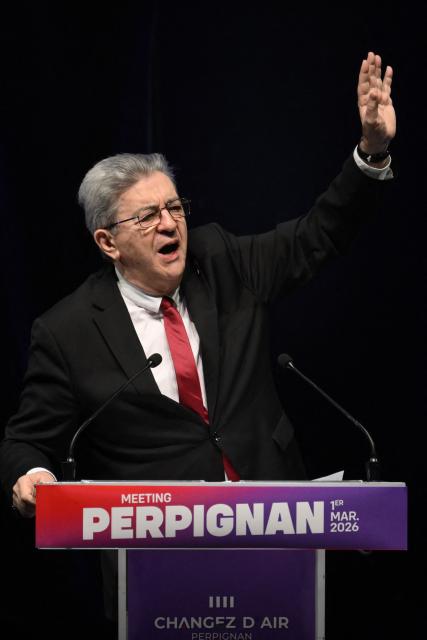 Leader of French leftist La France Insoumise (LFI) party Jean-Luc Melenchon waves as he arrives for a campaign rally of the LFI Perpignan mayoral candidate  ahead of France's municipal elections, in Perpignan, southern France, on March 1, 2026. French voters head to the polls for municipal elections on March 15 and 22, 2026. (Photo by Ed JONES / AFP)