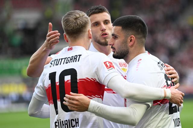 Stuttgart's German forward #26 Deniz Undav celebrates with his team mates after scoring his team's first goal during the German first division Bundesliga football match between VfB Stuttgart and VfL Wolfsburg in Stuttgart, southern Germany, on March 1, 2026. (Photo by THOMAS KIENZLE / AFP) / DFL REGULATIONS PROHIBIT ANY USE OF PHOTOGRAPHS AS IMAGE SEQUENCES AND/OR QUASI-VIDEO