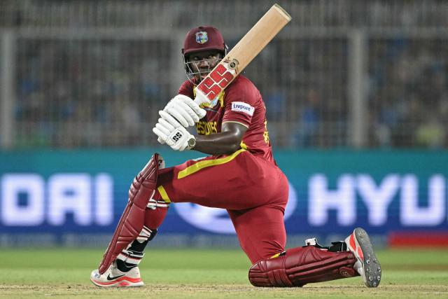 West Indies' Rovman Powell plays a shot during the 2026 ICC Men's T20 Cricket World Cup Super Eights match between India and West Indies at the Eden Gardens in Kolkata on March 1, 2026. (Photo by Dibyangshu SARKAR / AFP)