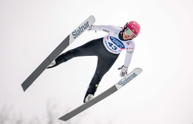 Canada's Abigail Strate soars through the air during the Women's Individual HS90 competition at the FIS Ski Jumping World Cup in Hinzenbach, Austria, on March 1, 2026. (Photo by GEORG HOCHMUTH / APA / AFP) / Austria OUT