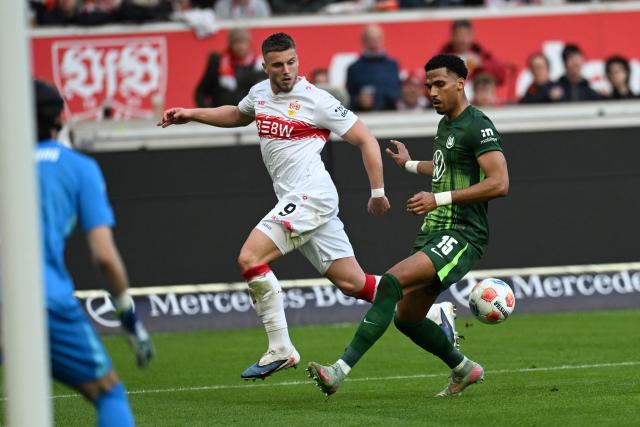 Stuttgart's Bosnian forward #09 Ermedin Demirovic and Wolfsburg's German defender #15 Moritz Jenz vie for the ball during the German first division Bundesliga football match between VfB Stuttgart and VfL Wolfsburg in Stuttgart, southern Germany, on March 1, 2026. (Photo by THOMAS KIENZLE / AFP) / DFL REGULATIONS PROHIBIT ANY USE OF PHOTOGRAPHS AS IMAGE SEQUENCES AND/OR QUASI-VIDEO