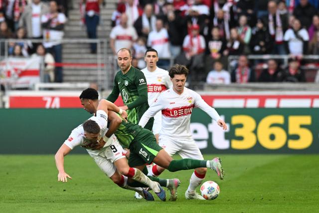 Stuttgart's Bosnian forward #09 Ermedin Demirovic and Wolfsburg's German defender #15 Moritz Jenz vie for the ball during the German first division Bundesliga football match between VfB Stuttgart and VfL Wolfsburg in Stuttgart, southern Germany, on March 1, 2026. (Photo by THOMAS KIENZLE / AFP) / DFL REGULATIONS PROHIBIT ANY USE OF PHOTOGRAPHS AS IMAGE SEQUENCES AND/OR QUASI-VIDEO
