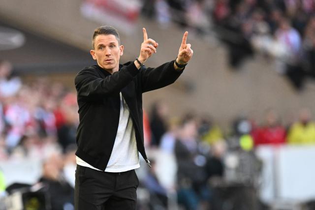 Wolfsburg's head coach Daniel Bauer reacts during the German first division Bundesliga football match between VfB Stuttgart and VfL Wolfsburg in Stuttgart, southern Germany, on March 1, 2026. (Photo by THOMAS KIENZLE / AFP) / DFL REGULATIONS PROHIBIT ANY USE OF PHOTOGRAPHS AS IMAGE SEQUENCES AND/OR QUASI-VIDEO