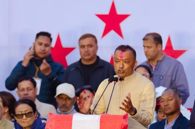 Nepali Congress party's president and election candidate Gagan Thapa (R) addresses supporters during a campaign rally in Kathmandu on March 1, 2026 ahead of parliamentary elections in Nepal. (Photo by Prabin RANABHAT / AFP)