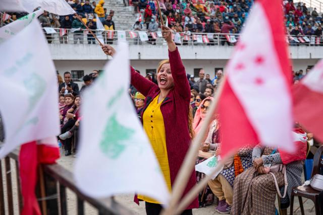 TOPSHOT - Supporters waving flags attend a campaign rally of Nepali Congress party president and election candidate Gagan Thapa in Kathmandu on March 1, 2026 ahead of parliamentary elections in Nepal. (Photo by Prabin RANABHAT / AFP)