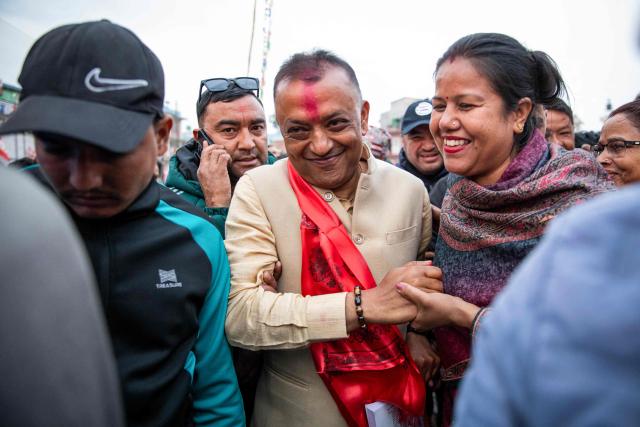 Nepali Congress party president and election candidate Gagan Thapa (C) greets supporters during a campaign rally in Kathmandu on March 1, 2026 ahead of parliamentary elections in Nepal. (Photo by Prabin RANABHAT / AFP)