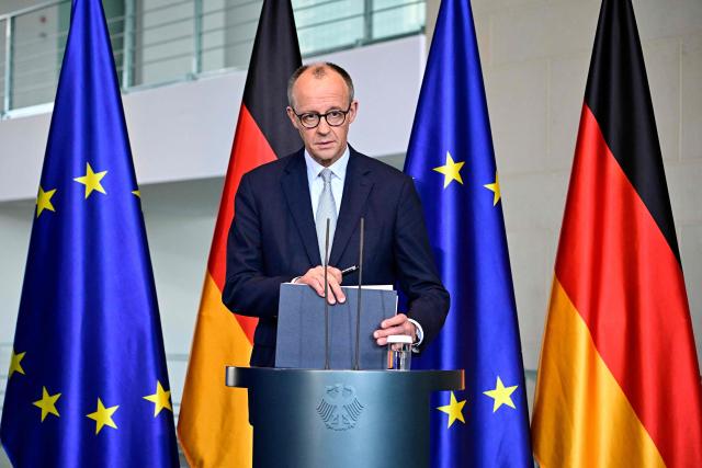German Chancellor Friedrich Merz leaves after a press conference on the situation in the Middle East at the Chancellery in Berlin on March 1, 2026.  (Photo by Tobias SCHWARZ / AFP)