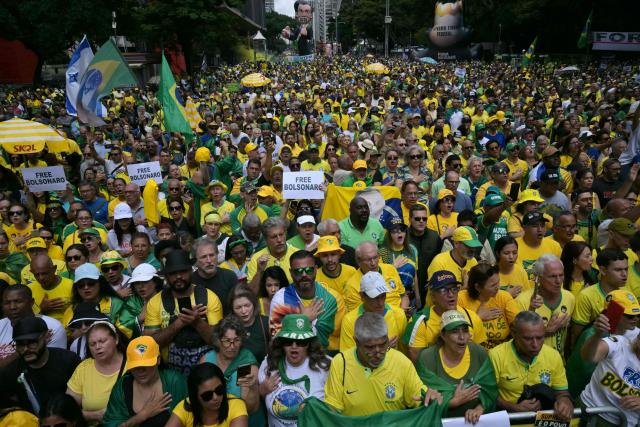 Supporters of former Brazilian president Jair Bolsonaro (2019-2022)—sentenced to 23 years and 3 months for attempted coup—take part in a demonstration in Sao Paulo, Brazil, on March 1, 2026. (Photo by NELSON ALMEIDA / AFP)