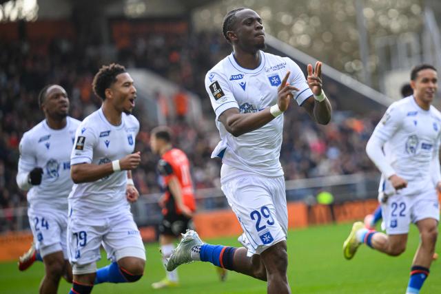 Auxerre's French defender #29 Marvin Senaya (C) celebrates after scoring his team's first goal during the French L1 football match between FC Lorient and AJ Auxerre at the Stade du Moustoir in Lorient, western France on March 1, 2026. (Photo by Loic VENANCE / AFP)