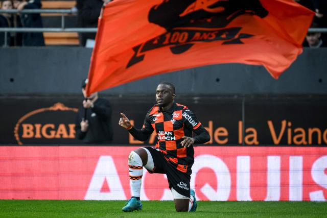 Lorient's Senegalese forward #12 Bamba Dieng celebrates after scoring his team's first goal during the French L1 football match between FC Lorient and AJ Auxerre at the Stade du Moustoir in Lorient, western France on March 1, 2026. (Photo by Loic VENANCE / AFP)