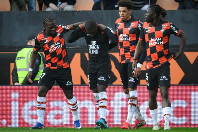 Lorient's Senegalese forward #12 Bamba Dieng (2nd L) celebrates with teammates after scoring his team's first goal during the French L1 football match between FC Lorient and AJ Auxerre at the Stade du Moustoir in Lorient, western France on March 1, 2026. (Photo by Loic VENANCE / AFP)