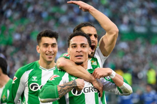 Real Betis' Brazilian forward #07 Antony (C) celebrates scoring the opening goal during the Spanish league football match between Real Betis and Sevilla FC at Benito Villamarin Stadium in Seville on March 1, 2026. (Photo by CRISTINA QUICLER / AFP)