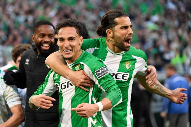 Real Betis' Brazilian forward #07 Antony (C) celebrates scoring the opening goal during the Spanish league football match between Real Betis and Sevilla FC at Benito Villamarin Stadium in Seville on March 1, 2026. (Photo by CRISTINA QUICLER / AFP)