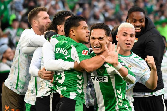 Real Betis' Brazilian forward #07 Antony (3R) celebrates scoring the opening goal during the Spanish league football match between Real Betis and Sevilla FC at Benito Villamarin Stadium in Seville on March 1, 2026. (Photo by CRISTINA QUICLER / AFP)