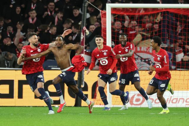 Lille's Belgian defender #03 Nathan Ngoy (2L) celebrates with teammates after scoring Lille's first goal during the French L1 football match between Lille LOSC and FC Nantes at the Stade Pierre-Mauroy in Villeneuve-d'Ascq, northern France, on March 1, 2026. (Photo by Francois LO PRESTI / AFP)