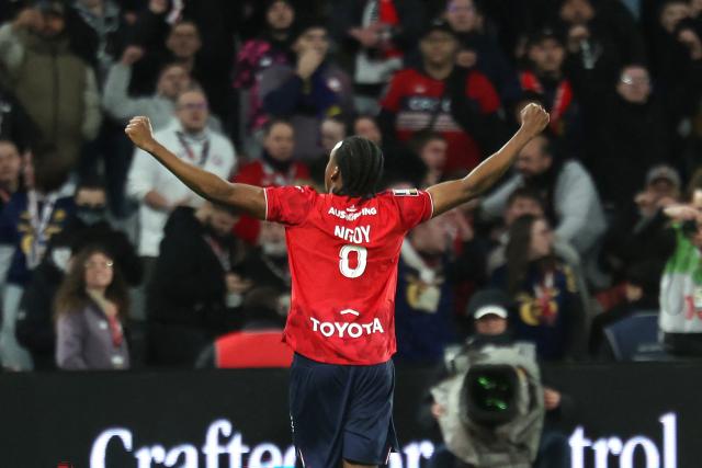 Lille's Belgian defender #03 Nathan Ngoy celebrates after scoring Lille's first goal during the French L1 football match between Lille LOSC and FC Nantes at the Stade Pierre-Mauroy in Villeneuve-d'Ascq, northern France, on March 1, 2026. (Photo by Francois LO PRESTI / AFP)