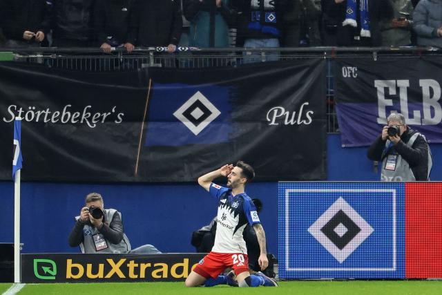Hamburg's Portuguese midfielder #20 Fabio Vieira celebrates scoring the opening goal during the German first division Bundesliga football match between Hamburger SV and RB Leipzig in Hamburg, northern Germany on March 1, 2026. (Photo by IBRAHIM OT / AFP) / DFL REGULATIONS PROHIBIT ANY USE OF PHOTOGRAPHS AS IMAGE SEQUENCES AND/OR QUASI-VIDEO