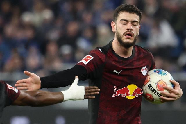 Leipzig's Brazilian forward #40 Romulo Cardoso celebrates scoring the 1-1 goal with his teammates during the German first division Bundesliga football match between Hamburger SV and RB Leipzig in Hamburg, northern Germany on March 1, 2026. (Photo by IBRAHIM OT / AFP) / DFL REGULATIONS PROHIBIT ANY USE OF PHOTOGRAPHS AS IMAGE SEQUENCES AND/OR QUASI-VIDEO
