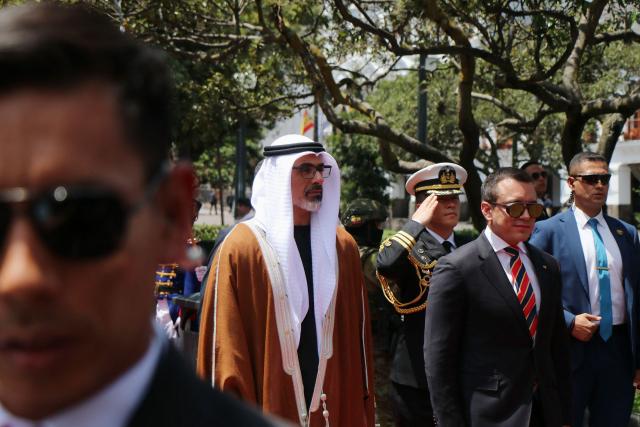 Abu Dhabi's Crown Prince Sheikh Khaled bin Mohamed bin Zayed Al Nahyan (C-L) and Ecuador's President Daniel Noboa (C-R) arrive at the Independence Square to lay a floral offering during a visit in Quito on March 1, 2026. (Photo by Galo Paguay / AFP)