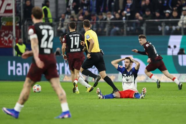 Hamburg's Portuguese midfielder #20 Fabio Vieira (R) reacts during the German first division Bundesliga football match between Hamburger SV and RB Leipzig in Hamburg, northern Germany on March 1, 2026. (Photo by IBRAHIM OT / AFP) / DFL REGULATIONS PROHIBIT ANY USE OF PHOTOGRAPHS AS IMAGE SEQUENCES AND/OR QUASI-VIDEO