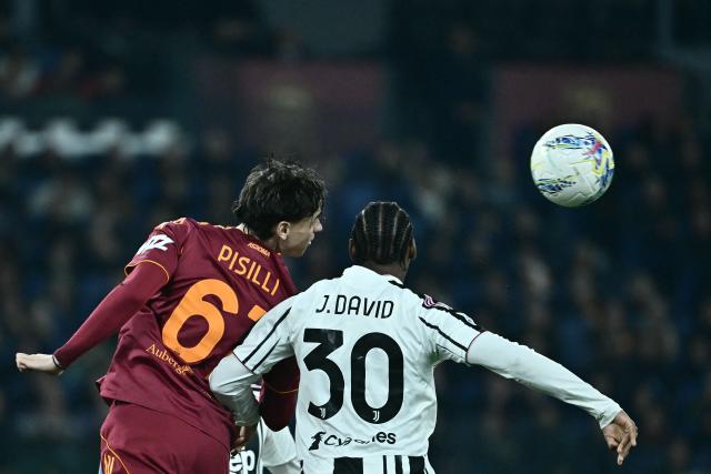 Roma's Italian midfielder #61 Niccolo Pisilli (L) and Juventus' Canadian forward #30 Jonathan David (R) fight for the ball during the Italian Serie A football match between AS Roma and Juventus at the Olympic Stadium in Rome on March 1, 2026. (Photo by Filippo MONTEFORTE / AFP)