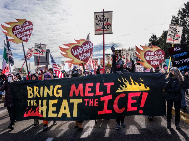 Indigenous and local activists march outside the Bishop Henry Whipple Federal Building during a protest opposing US Immigration and Customs Enforcement (ICE) operations, in Minneapolis, Minnesota, on March 1, 2026. Demonstrators carried signs reading “Bring the Heat, Melt the ICE,” “Land Back Now,” and “Free Our Indigenous Relatives Now.” Organizers maintained a prayer camp at the sacred site of Mni Owe Sni (Coldwater Spring) across from the building, calling for ICE’s withdrawal from Minnesota and accountability for immigration enforcement practices. (Photo by Kerem YUCEL / AFP)