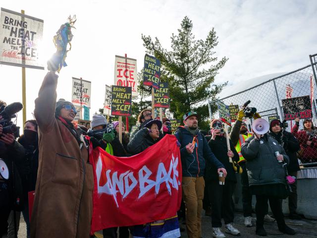Indigenous and local activists march outside the Bishop Henry Whipple Federal Building during a protest opposing US Immigration and Customs Enforcement (ICE) operations, in Minneapolis, Minnesota, on March 1, 2026. Demonstrators carried signs reading “Bring the Heat, Melt the ICE,” “Land Back Now,” and “Free Our Indigenous Relatives Now.” Organizers maintained a prayer camp at the sacred site of Mni Owe Sni (Coldwater Spring) across from the building, calling for ICE’s withdrawal from Minnesota and accountability for immigration enforcement practices. (Photo by Kerem YUCEL / AFP)