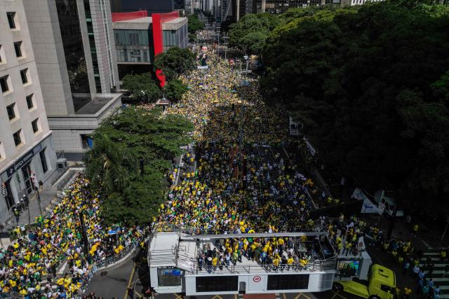 Aerial view of supporters of Brazil's former president Jair Bolsonaro (2019-2022), sentenced to 23 years and 3 months for attempted coup, taking part in a demonstration in Sao Paulo, Brazil, on March 1, 2026. (Photo by Nelson ALMEIDA / AFP)