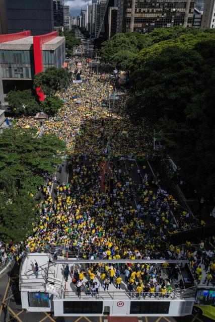 Aerial view of supporters of Brazil's former president Jair Bolsonaro (2019-2022), sentenced to 23 years and 3 months for attempted coup, taking part in a demonstration in Sao Paulo, Brazil, on March 1, 2026. (Photo by Nelson ALMEIDA / AFP)