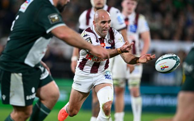 Bordeaux' French scrum-half Maxime Lucu passes the ball during the French Top14 rugby union match between Section Paloise Bearn Pyrenees (Pau) and Union Bordeaux Begles at the Stade du Hameau stadium in Pau, south-western France on March 1, 2026. (Photo by Gaizka IROZ / AFP)